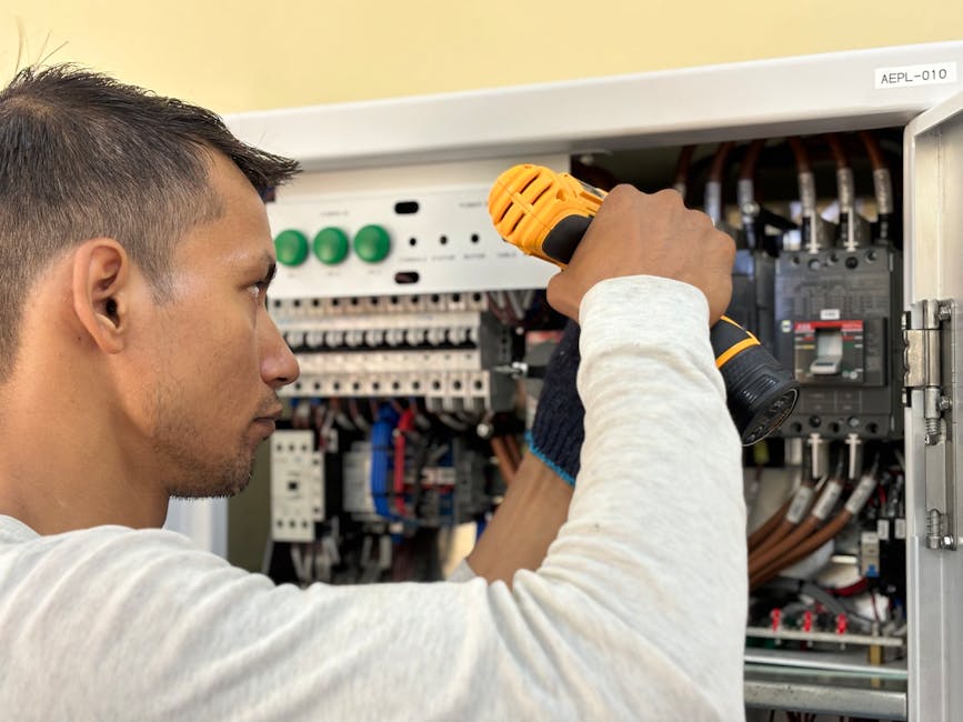 Electrician working on circuit breaker panel when circuit breaker keeps tripping