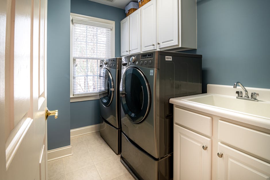 Clean residential laundry room where a dryer not heating problem can usually be solved with basic tools