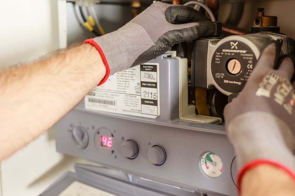Plumber adjusting a water heater no hot water gas valve and instrumentation
