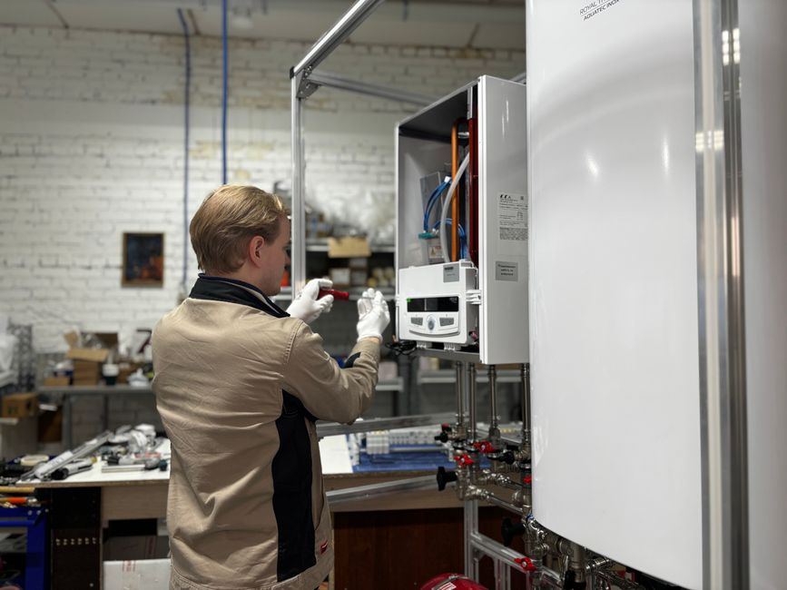 Water heater making noise inspection: a technician examining a heating and hot-water system, the point at which a stubborn water heater making noise should be handed to a licensed pro