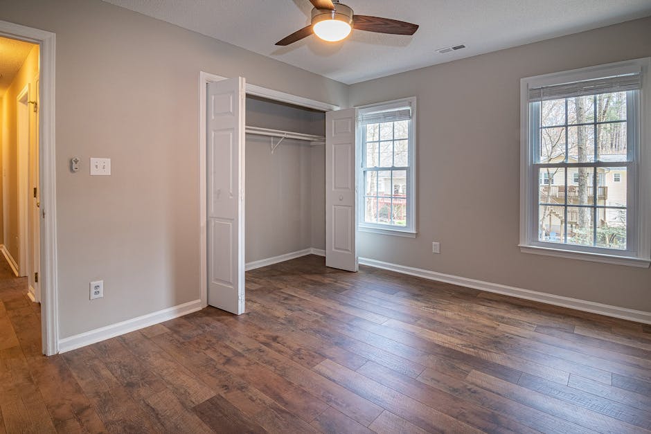 Ceiling fan not working in a modern bedroom with wooden floor and open closet