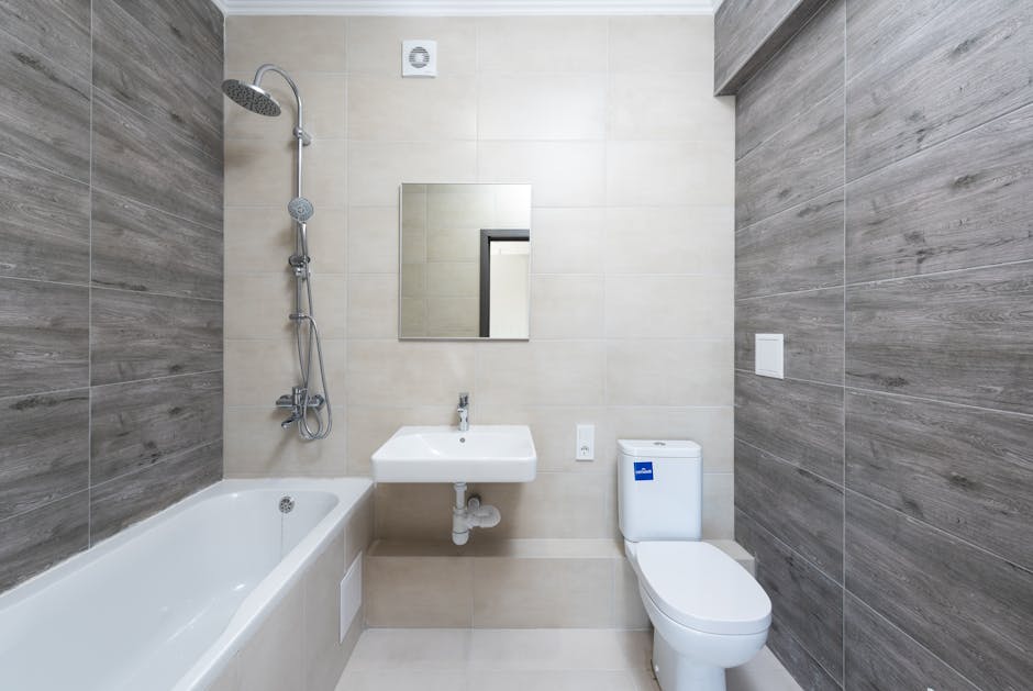 Toilet tank not filling: a standard white residential ceramic toilet installed next to a glass shower enclosure in a clean bathroom, the typical setup where a toilet tank not filling complaint shows up after flushing and the bowl never refills to the normal water line